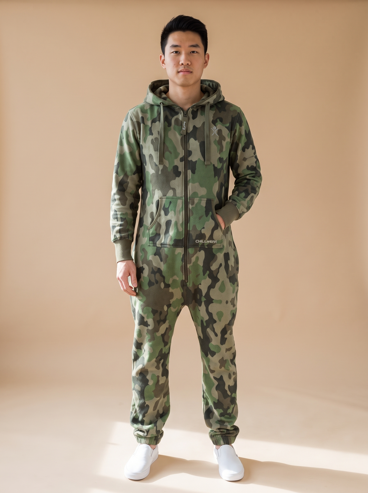 Camo Green, green camouflage print onesie, front view on a man | Unichill adult unisex jumpsuit designed in Calgary