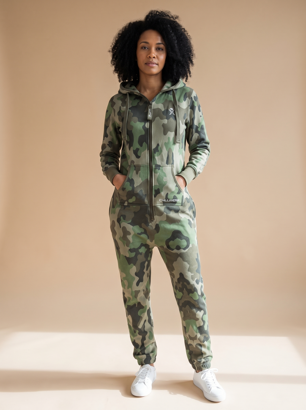 Camo Green, green camouflage print onesie, front view on a woman | Unichill adult unisex jumpsuit designed in Calgary