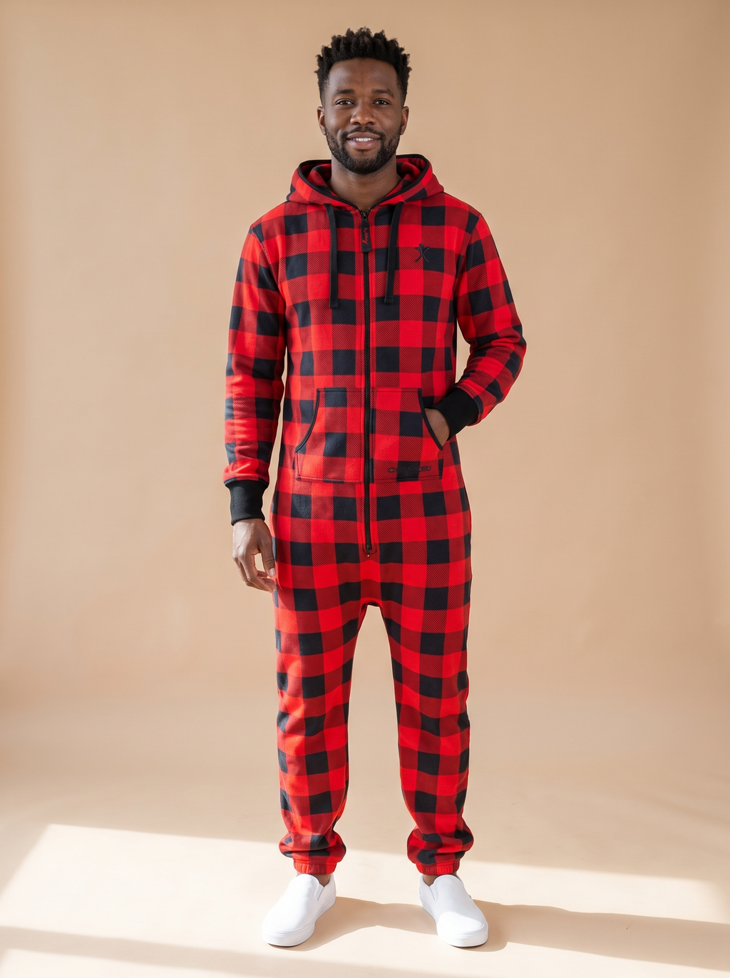 Buffalo Plaid, red and black buffalo check onesie, front view on a man | Unichill adult unisex jumpsuit designed in Calgary