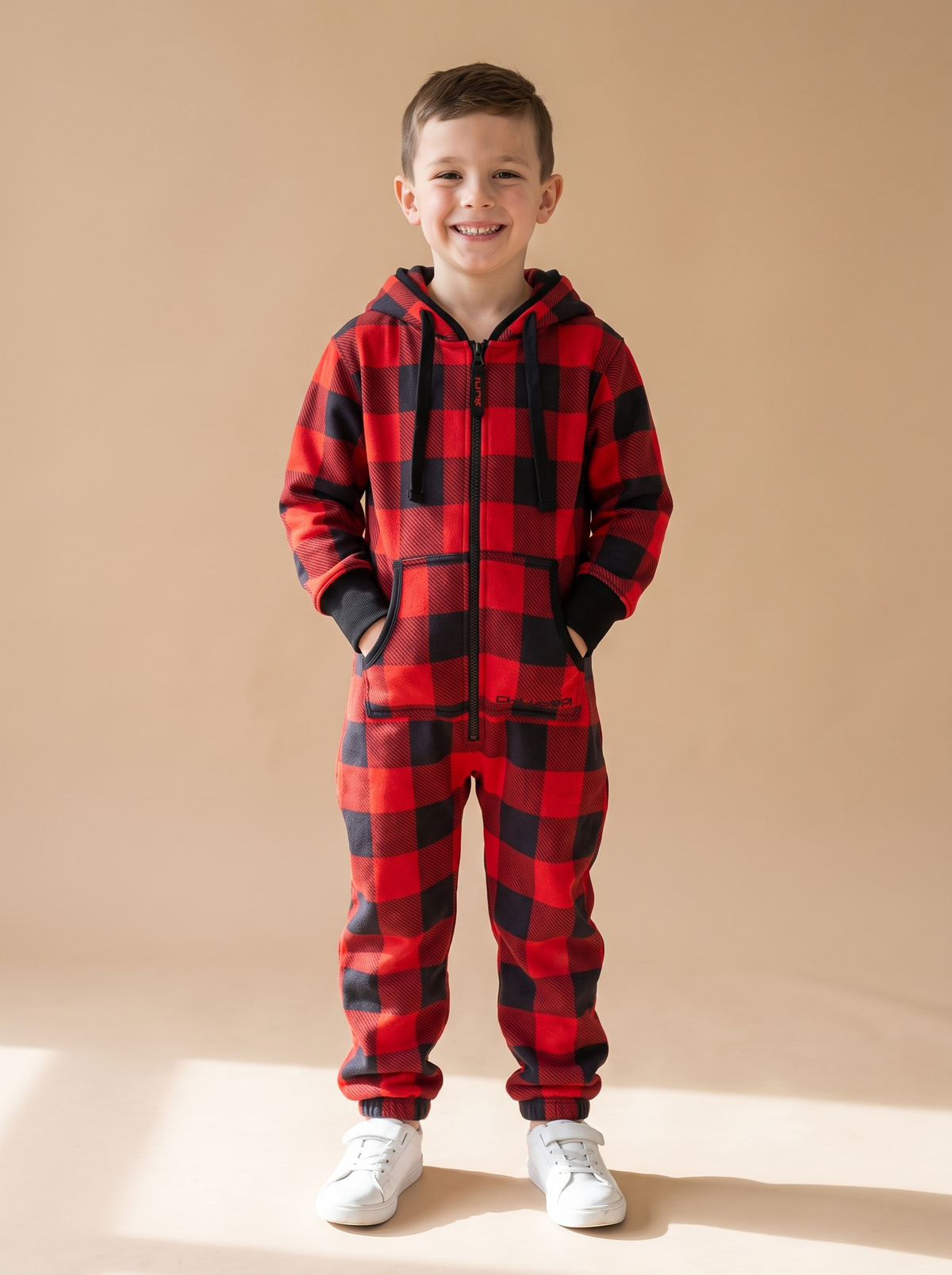 Buffalo Plaid Kids, red and black buffalo check kids onesie, front view on a boy | Unichill kids jumpsuit designed in Calgary
