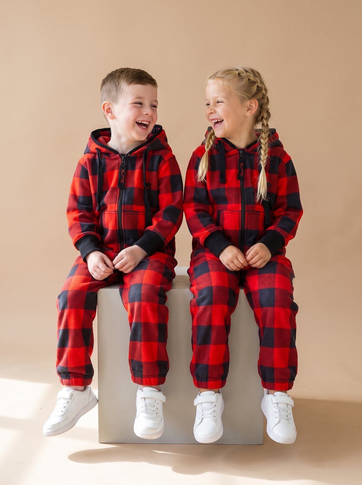 Buffalo Plaid Kids, red and black buffalo check kids onesie, lifestyle photo | Unichill kids jumpsuit designed in Calgary