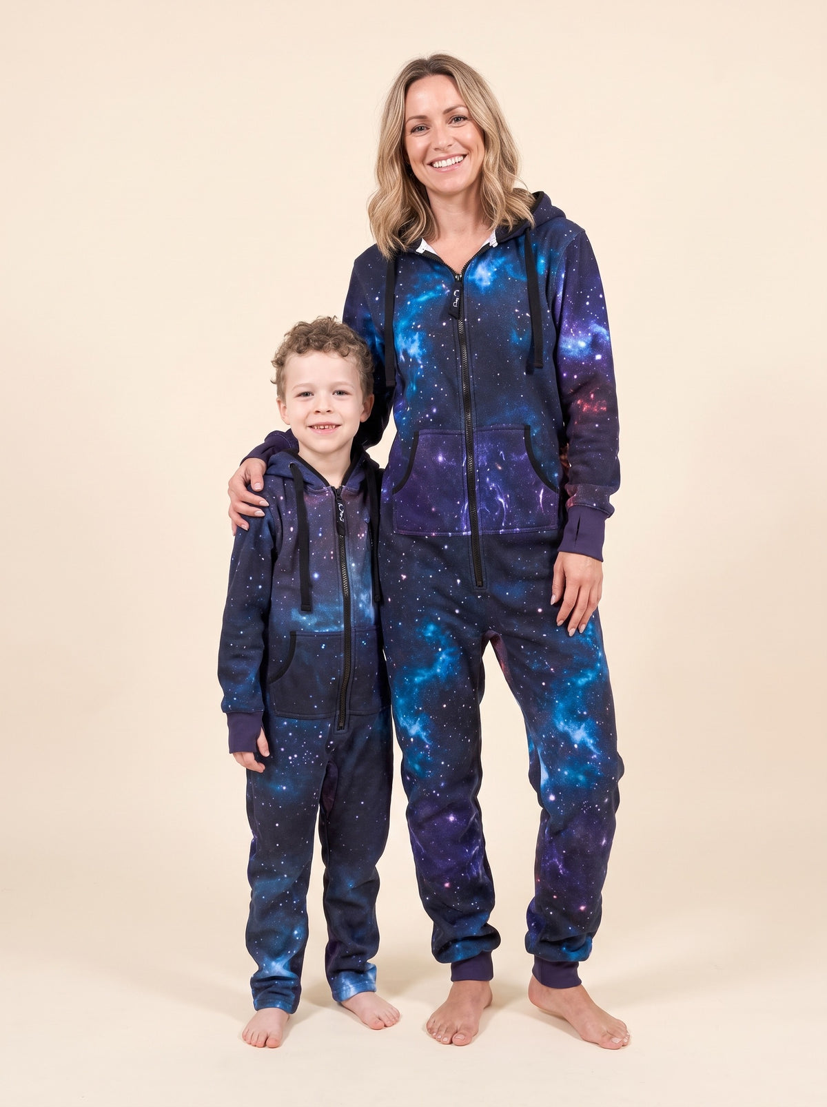 Matching Galaxy onesies for adults and kids