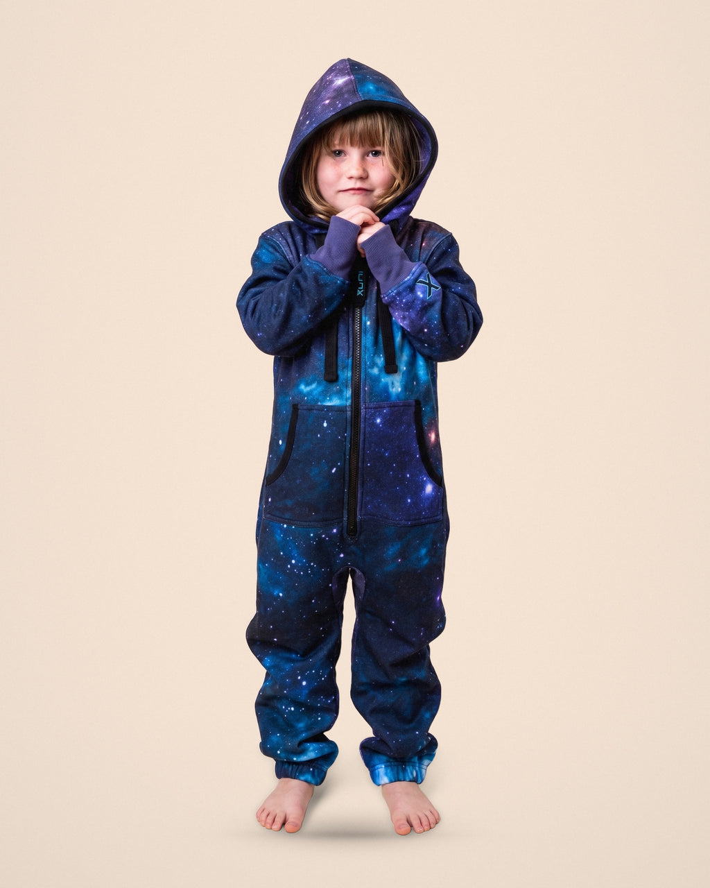 Galaxy Kids, galaxy space print kids onesie, front view with the hood up | Unichill kids onesie designed in Calgary