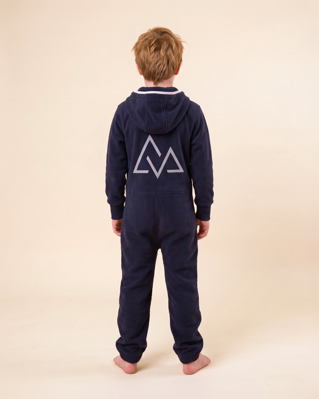 7Summits Kids, navy kids onesie with white chevron stripes, 7Summits x Mike Hamill collaboration, back view with the mountain logo | Unichill kids onesie designed in Calgary