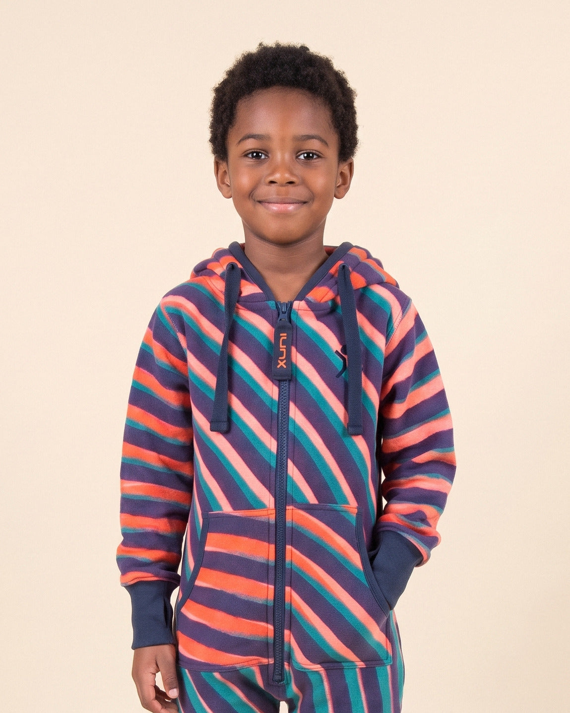 Vinyl Kids, coral, navy and teal diagonal stripe kids onesie, Rhys Douglas Farrell collaboration, close-up of the hood, zipper and print | Unichill kids onesie designed in Calgary